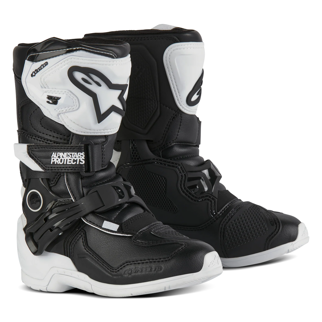 Black and white motocross boots with Alpinestars branding on a white background