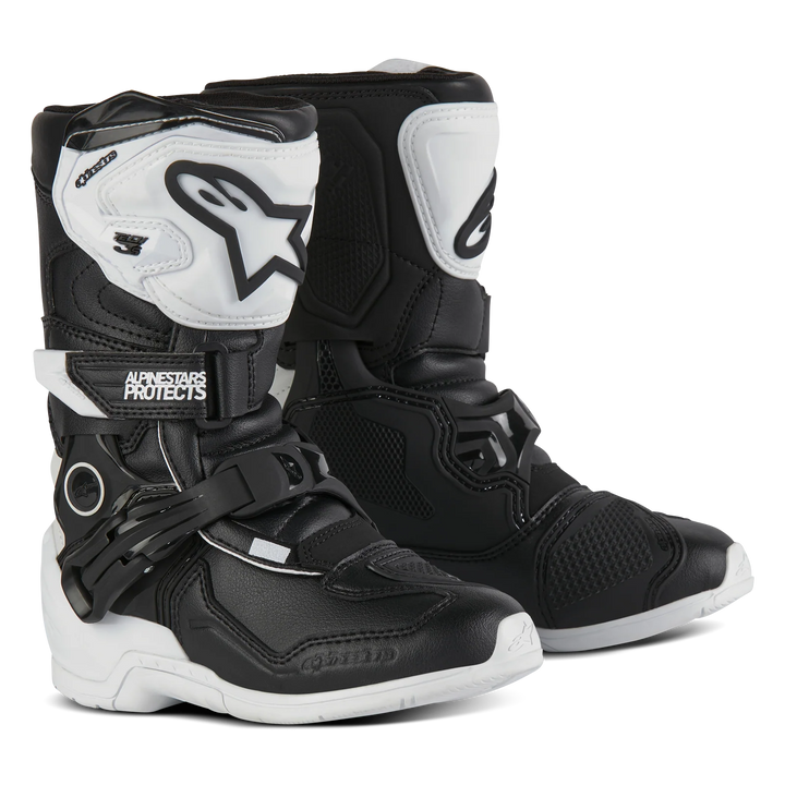 Black and white motocross boots with Alpinestars branding on a white background